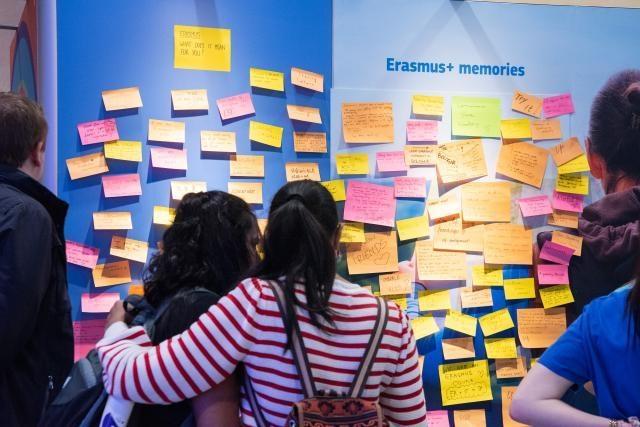 People looking at a wall full of Erasmus memories during the Open Doors Day
