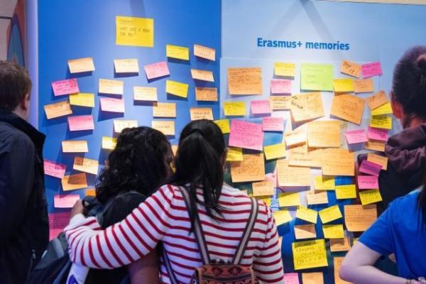 People looking at a wall full of Erasmus memories during the Open Doors Day